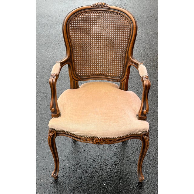 Beautiful set of Louis XV chairs circa 1920-30s. Features solid walnut construction, caned backs, upholstered seats,...