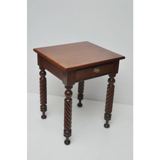 The table has a beautiful cherry top and with its bold look of finely turned rope legs can be successfully placed next to...