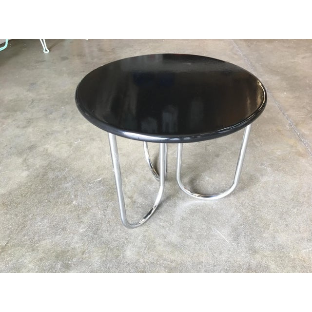 Streamline Art Deco coffee table manufactured by Royalchrome. The table features chromed U-shaped tubular legs with a...