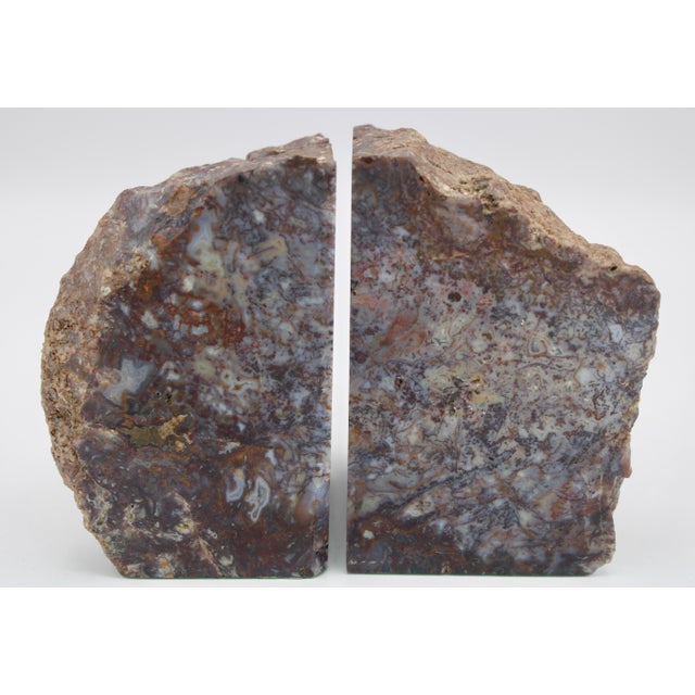 A large pair of mid century modern style agate bookends with felt on the underside. The coloration of these bookends is...