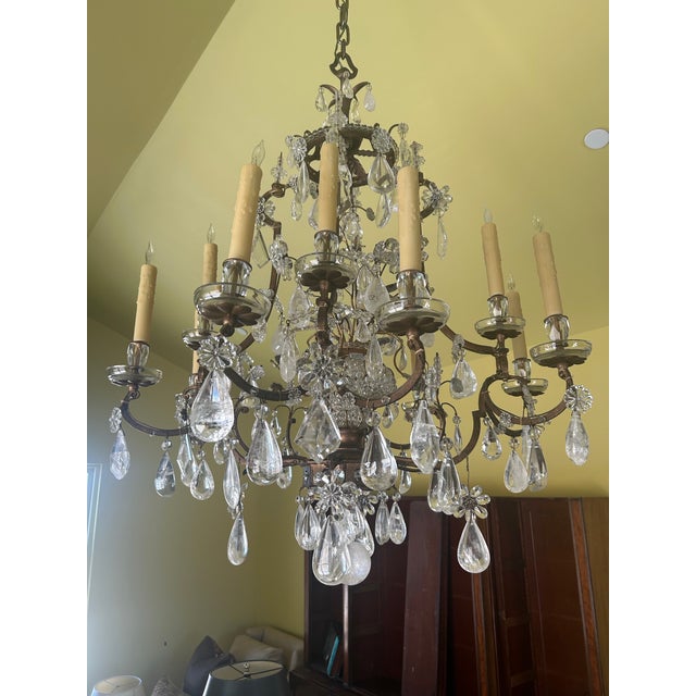 This exquisite French chandelier, attributed to the renowned Maison Baguès, embodies the refined elegance of the Louis XV...