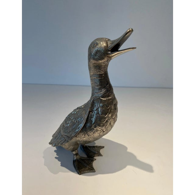 This large, finely carved duck is made of silver-plated bronze. It is a French work. Circa 1970 (Part of a set of 3 ducks...