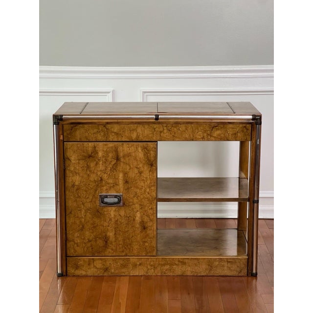 Vintage 1970s Hollywood Regency expandable burl wood server with chrome bar detail. It features a dual lift open top with...