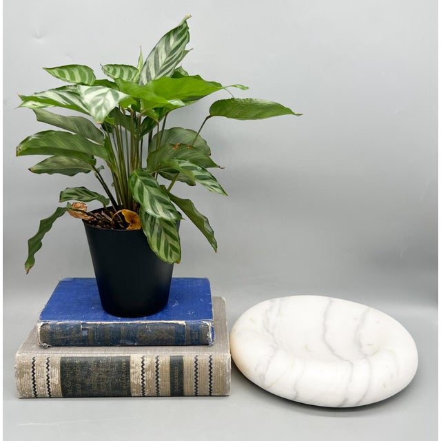 Stunning late 20th to early 21st-century white marble catchall dish with softly rounded edges and subtle natural gray...