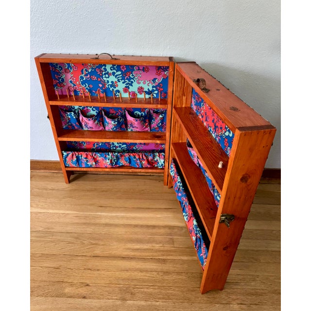 One-of-a-kind handmade folding sewing and craft cabinet, thoughtfully built from solid pine and finished with vibrant...