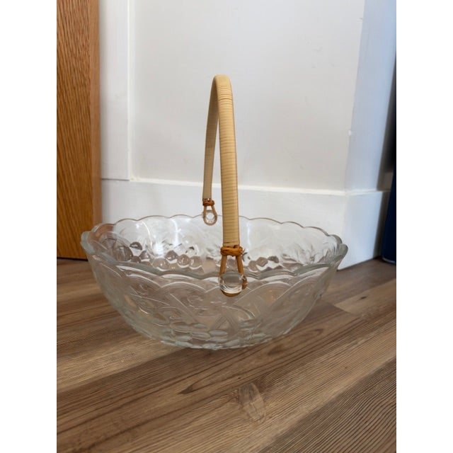 Vintage clear pressed glass fruit basket bowl featuring an embossed fruit pattern (such as grapes or floral elements) and...