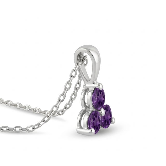 This elegant pendant showcases the captivating beauty of Amethyst gemstones, arranged in a refined three-stone cluster...
