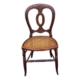 Early 20th Century Antique Victorian Eastlake Solid Walnut Cane Bottom Carved Dinning Parlor Side Chair For Sale