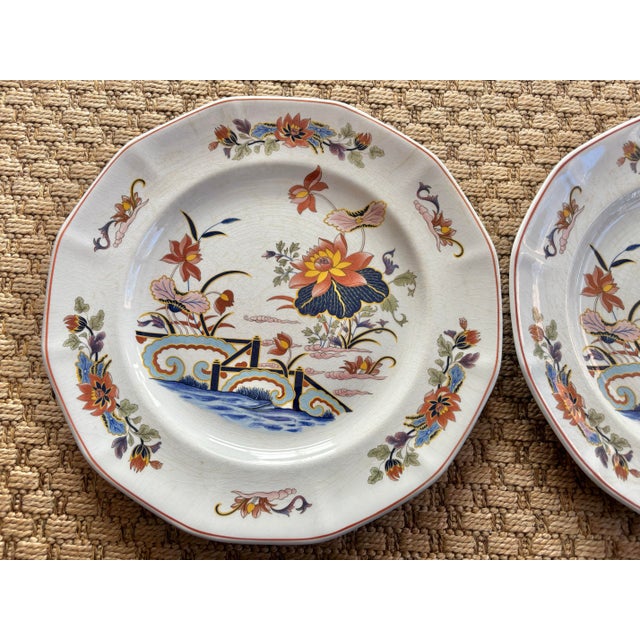 A pair of decorative Georgetown Collection Wedgwood matching plate pair, made in England. Features the lovely lotus motif...