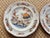 A pair of decorative Georgetown Collection Wedgwood matching plate pair, made in England. Features the lovely lotus motif...
