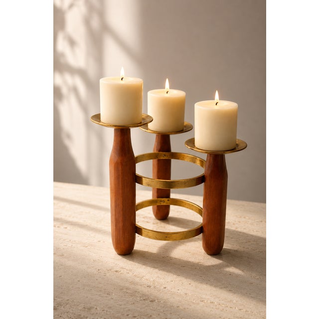 A stunning sculptural mid-century candelabra crafted from fine solid teak wood and brass. This piece perfectly embodies...
