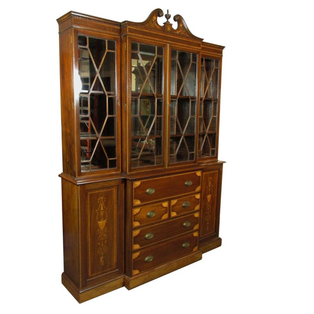 An English Import Edwardian breakfront. Features extensive satinwood inlays and banding, dovetail drawer construction,...