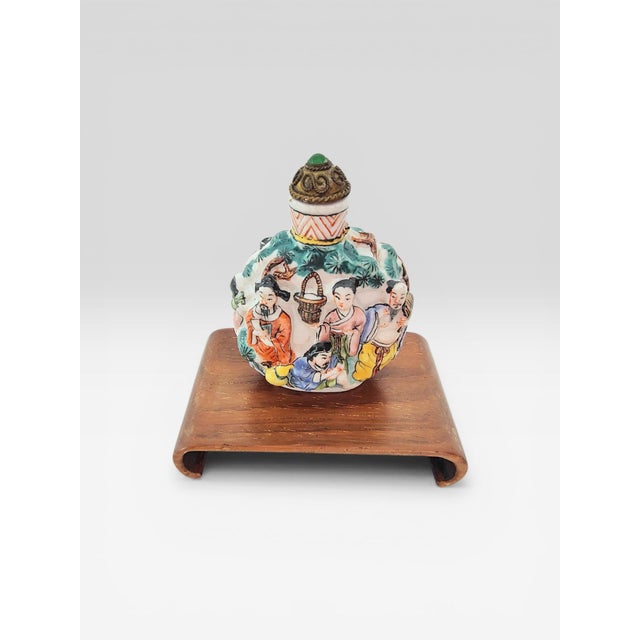Antique 19th Century Chinese Famille Rose Molded Porcelain Snuff Bottle with Qianlong Mark This exceptional 19th-century...