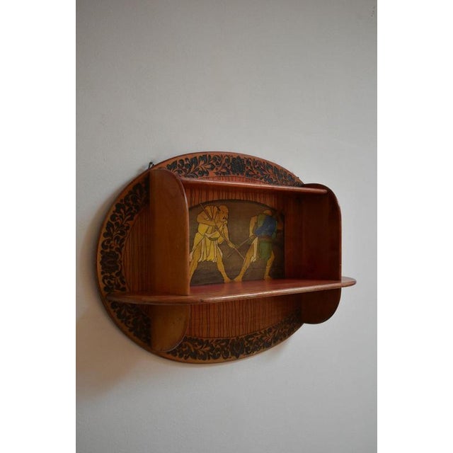Art Nouveau mural bookcase, 1900s. Art Nouveau wall bookcase in stained wood with pyrography decoration of Japanese style...