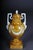 Extremely decorative Amphora vase. with beautiful mascarons. Classic style Amphora. Brown background with white Classic...