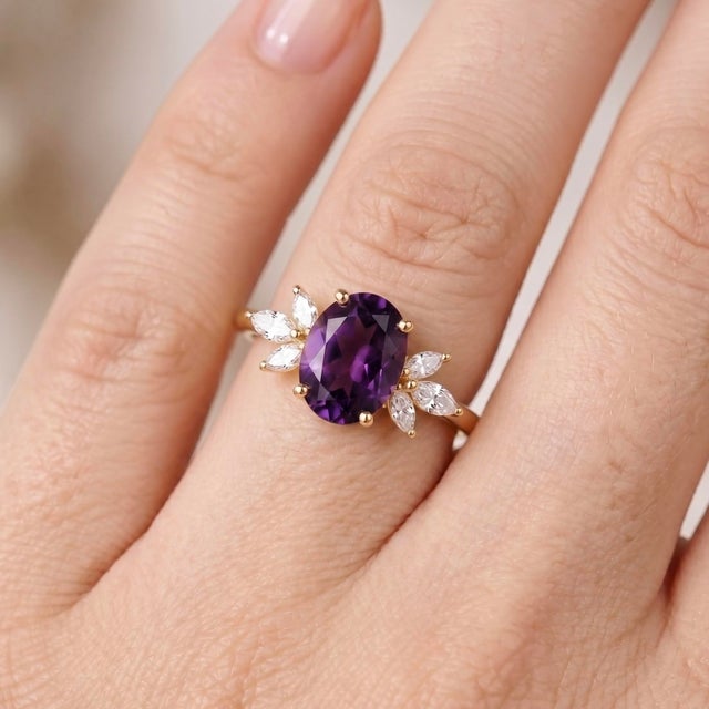 Capture the enchanting beauty of royal purple with this stunning oval amethyst cluster ring. This eye-catching design...