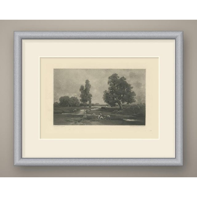A quiet french pastoral scene: a shallow stream winds across open meadow under a heavy, cloud-filled sky. A young...