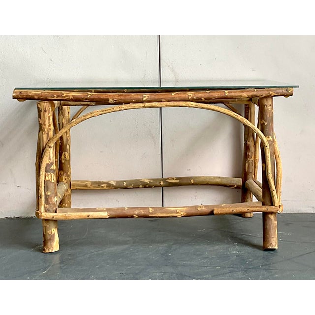 Discover the organic charm of this vintage bent branch coffee table, a captivating piece that effortlessly marries rustic...