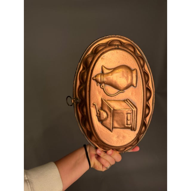 Late 19th-century French copper mold with hanging eyelet, circa 1890. This charming kitchen accessory features a...