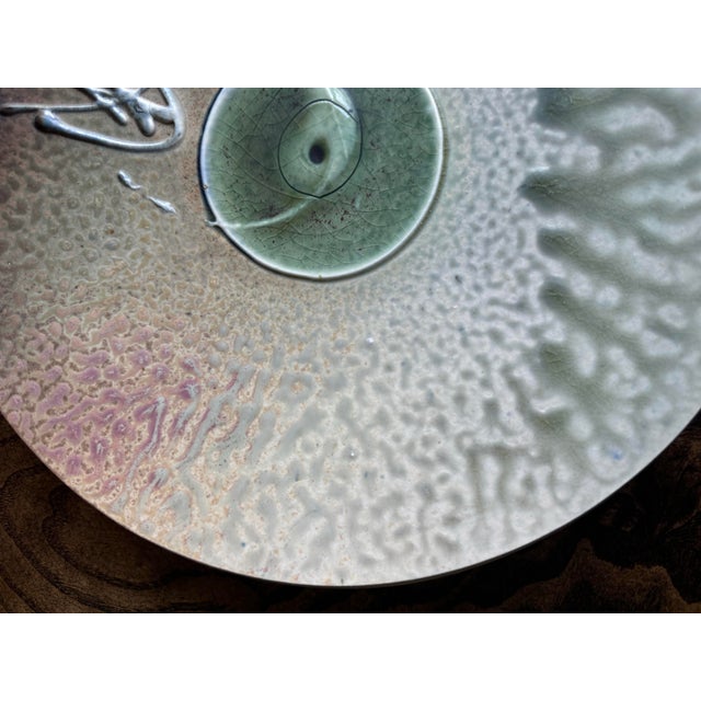 Unbelievable piece of signed studio pottery (this is a high fire ash glazed piece which is how the artist achieved such...