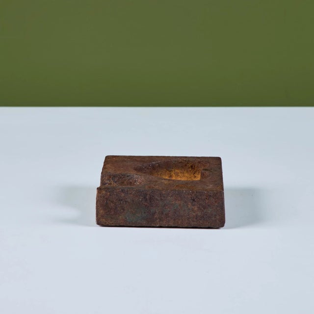 Square cast iron ashtray with off center heart well and large oval divot. The thick ashtray would be a great catchall or...