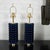 Pair of dark blue "bubble" motif ceramic table lamps with brass hardware.