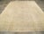 An antique Turkish Oushak room size carpet. Light Oushaks, as here with an oyster tonality, never seem to go out of style....