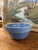 Vintage stoneware mixing bowl featuring a speckled blue glaze and a raised geometric band encircling the rim. The design...