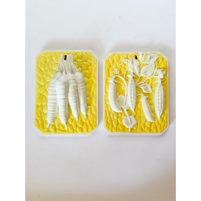 Sunny and cheerful yellow Italian ceramic wall art plaques featuring raised white relief veggies, carrots and peas. This...