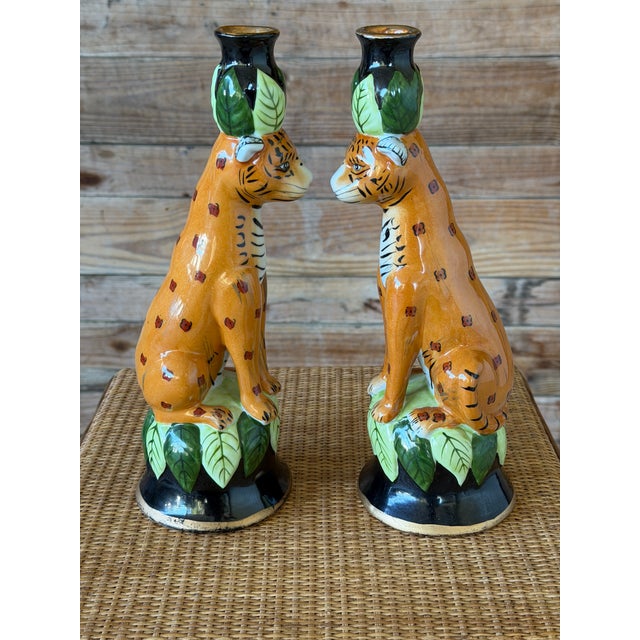 A whimsical pair of vintage figural ceramic candlestick holders crafted in the manner of Lynn Chase, featuring seated...