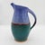 The Skinny This is the kind of pitcher that earns its place on a shelf. Hand-thrown studio pottery with a saturated...