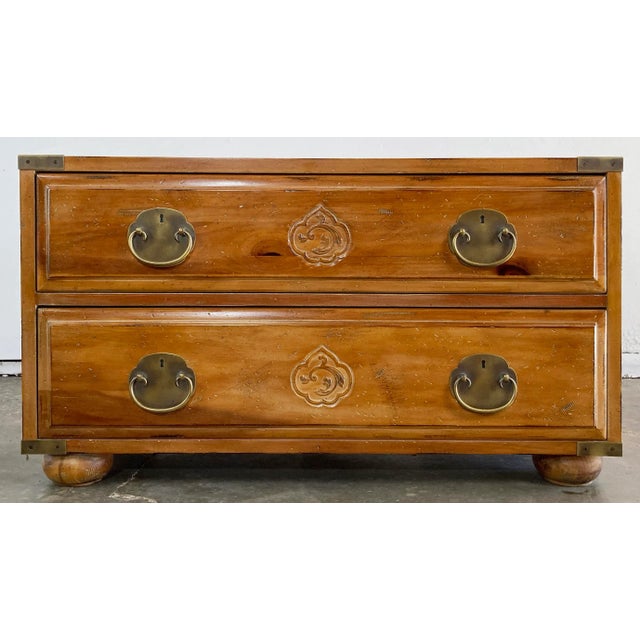 Vintage Henredon footed campaign two (2) drawer pine chest. Features carved Asian motif medallions to drawer fronts with...