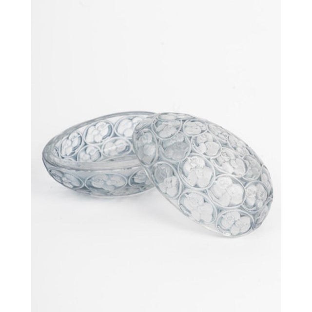 "Chicks" box in molded pressed white glass, enhanced with a blue-gray patina. Molded signature on the reverse. Model...