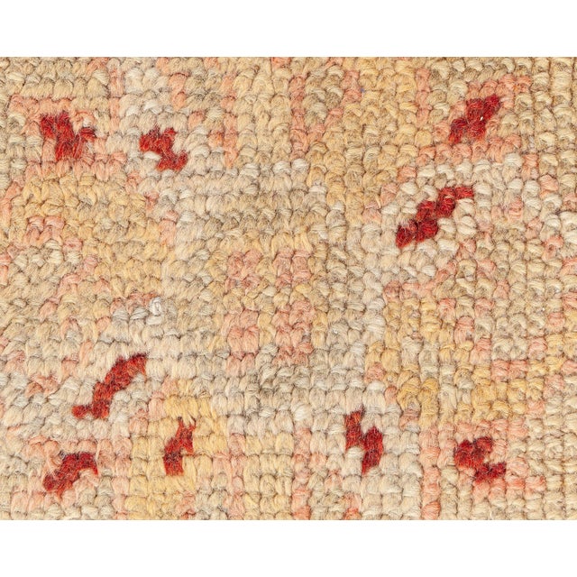 This exquisite Turkish Oushak rug, dating from the 1920s, epitomizes the timeless elegance and masterful craftsmanship...