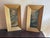 Pair of vintage-style still life artworks featuring violin and floral arrangements in traditional interiors. One...