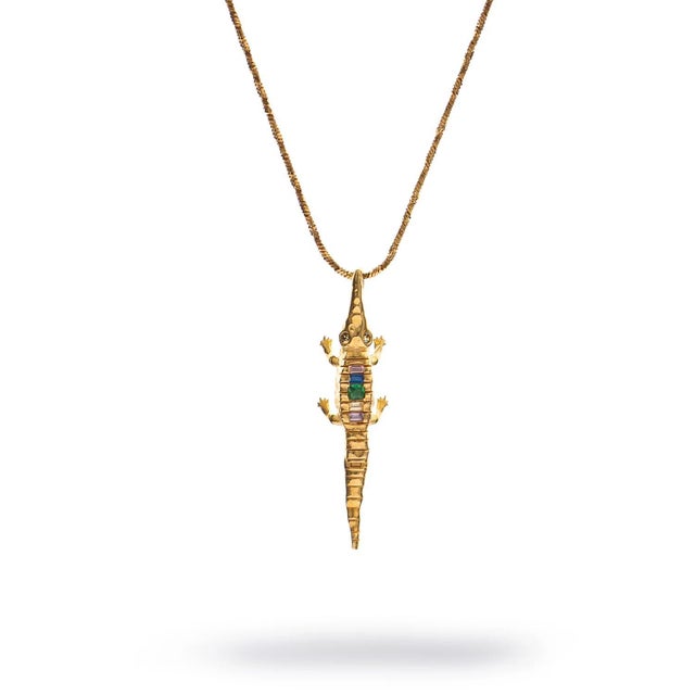 Step into the mystic energy of ancient guardianship with the Guardian Crocodile Multicolor Crystal Gold Necklace. This...
