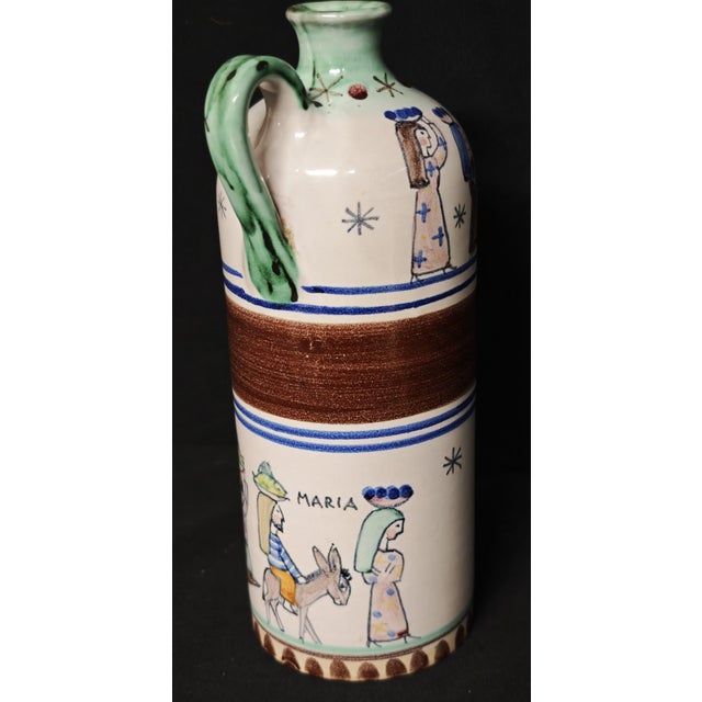 Vietri artistic ceramic bottle, made and signed by V. Pinto, dating back to the 1960s. The cylindrical body is hand-...