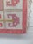 A beautiful mid-century Swedish rölakan flatweave in a warm palette of raspberry pink, coral, ivory and ochre. The...