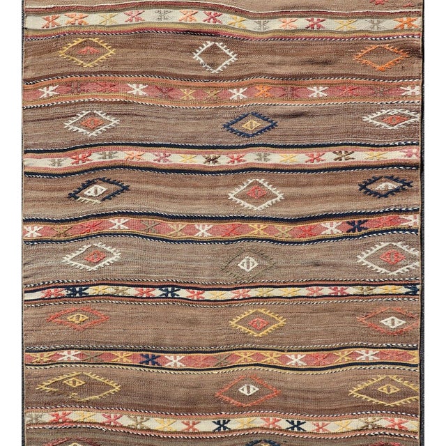 Measures: 4'6" x 8'10" Geometric Stripe Design Turkish Vintage Kilim Rug in Warm Earth Tones. Keivan Woven Arts / rug...