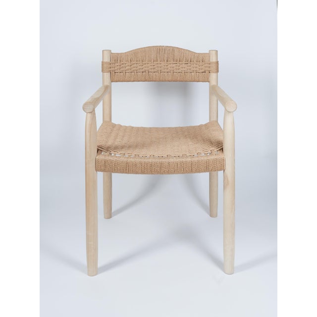 The Dining Chair in Ash with Handwoven Danish Cord Seat and Back is designed and handcrafted by Valeriy Khvan. Rooted in...