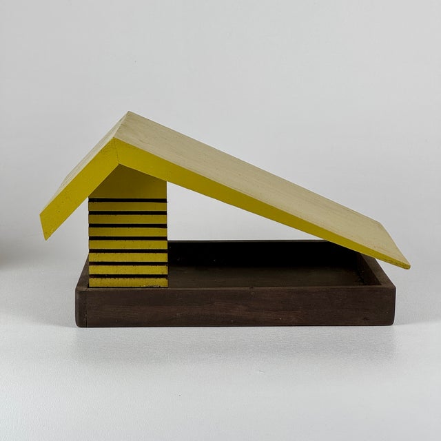 A brilliant piece of Mid-Century Modern in a form of an architectural house decor. Was it intentionally meant as a bird...