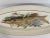 A stunning elongated 24.5" oval shaped ceramic Longchamp serving platter displaying a handsome game fish. Circa Late 19th...