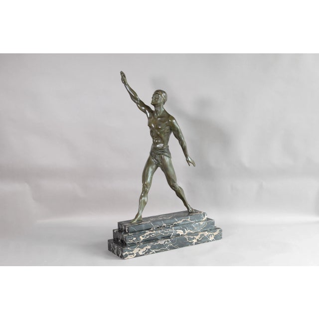 Large bronze model of an Olympian figure on a tiered marble base. Signed Editions Paris and G. Daverny. France circa 1930.