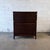 A striking Danish modern high chest by Svend Langkilde, crafted in richly figured rosewood during the 1960s. The cabinet...