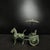A striking Chinese bronze sculpture of a horse-drawn chariot. The piece features a stylized horse with a raised tail...