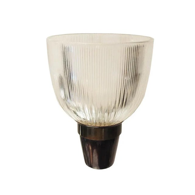 Brass, metal and glass wall sconce designed by Ignazio Gardella and manufactured by Azucena, Italy, 1960s. This piece is...