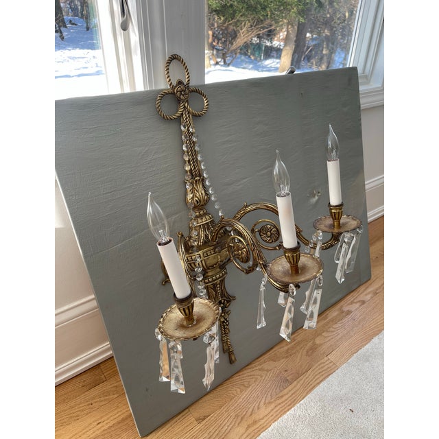 Make a grand impression with this pair of Large Antique Sconces circa 1940’s. Classic French design of rosettes and...