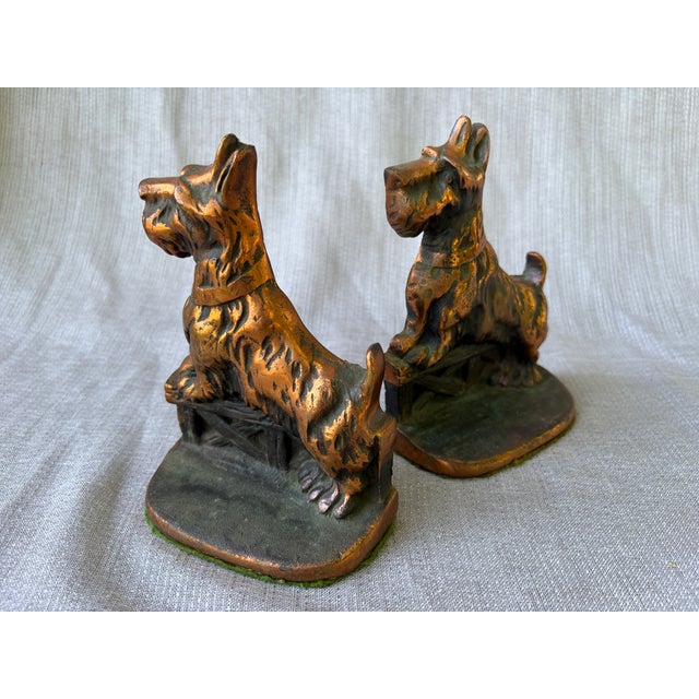 Heavy, charming vintage cast iron and copper Scottie dog bookends, a pair. Green felt on the bases. Very nice vintage...