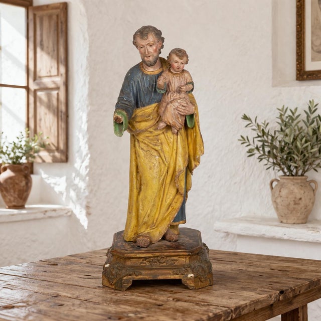 VERY FINE POLYCHROMED STATUE OF SAINT JOSEPH CARRYING THE INFANT CHRIST Probably Spanish circa 17th/18th century 19" H x 7...