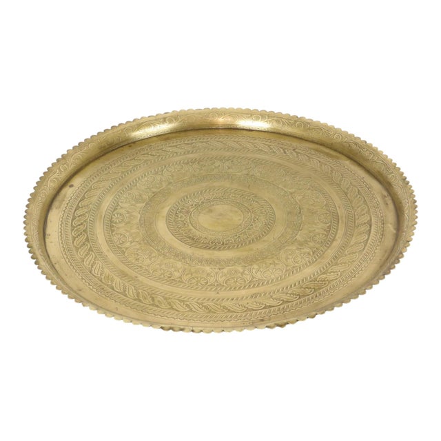 An extra-large Oriental tray made of yellow copper—better known as brass—featuring elaborate floral and geometric...